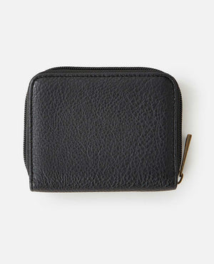 The Rip Curl Wanderer Small Zip Wallet boasts a minimalist design, featuring black leather with a textured surface and a secure zipper closure, elegantly set against a white background.