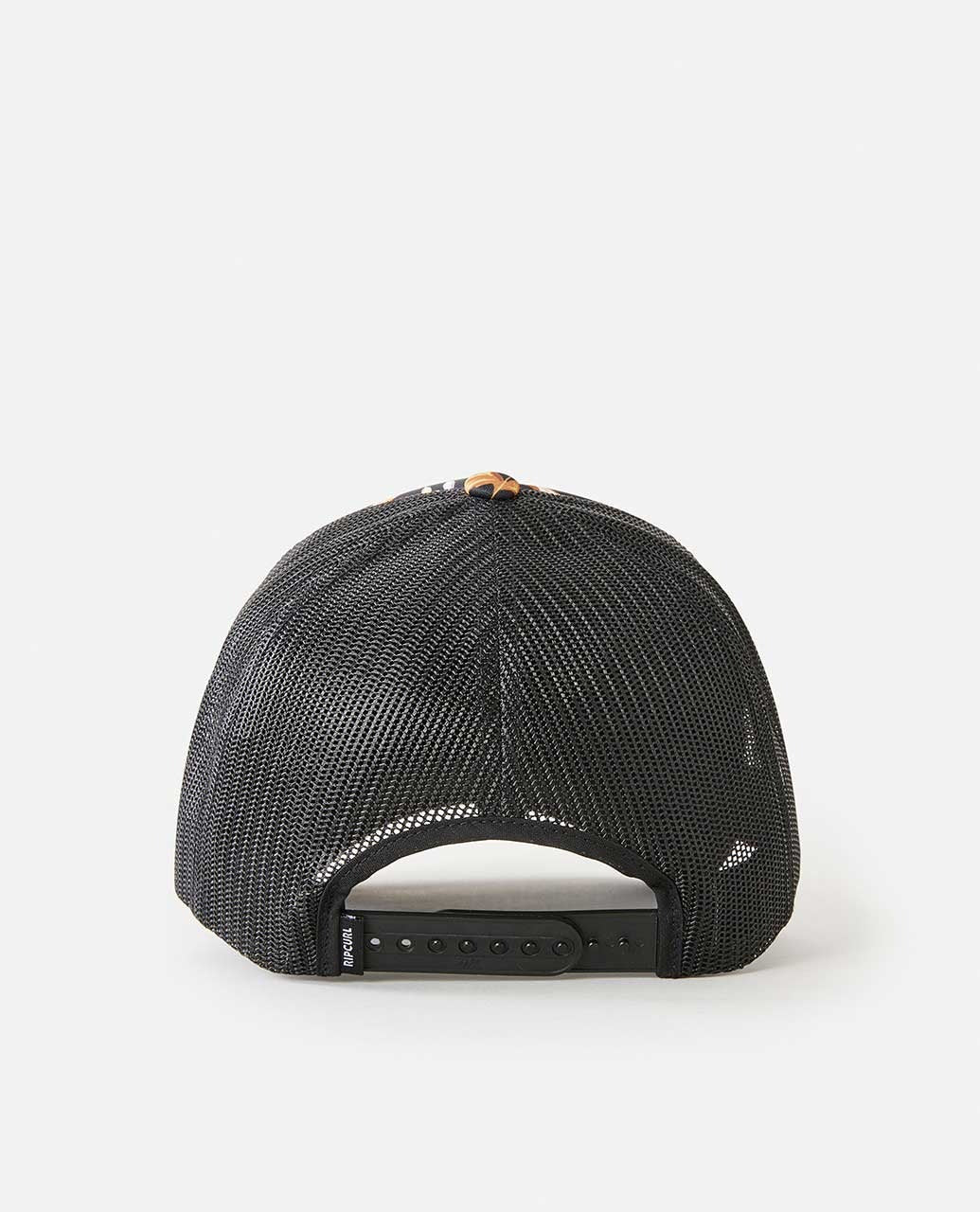 The Rip Curl La Isla Trucker hat in black is shown from behind, highlighting its mesh back, adjustable snapback strap, and a small label on the left side of the strap against a white background.