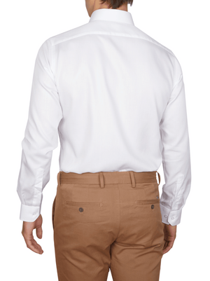 A person wears an Abelard Non Iron Cotton Twill Slim Fit Shirt in white with a cutaway collar, paired with light brown pants featuring buttoned back pockets.