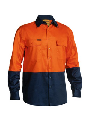 The Bisley Hi Vis Drill Shirt is a long-sleeved, high-visibility work shirt with an orange upper section and a navy blue lower section, sleeves, and collar. It features buttoned chest pockets and a front button closure, ensuring maximum visibility and comfort on the job site.