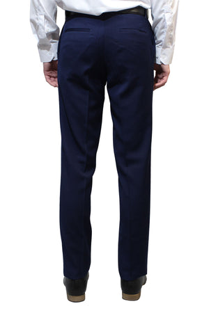 A person stands with their back to the camera against a white background, wearing a white dress shirt, Bruton Jesse Trouser in dark blue with hip pockets (slim fit), and black shoes.