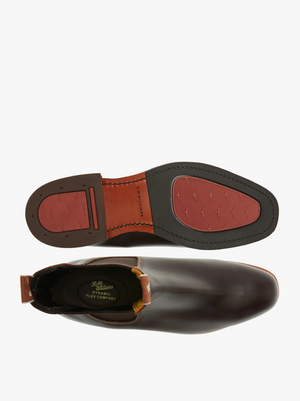 Top and bottom view of the RM Williams Dynamic Flex Craftsman Boot in brown Yearling leather with red accents on the sole. The top view showcases the boot's opening with a pull tab, and the interior reads "Flex Comfort." The bottom sole view highlights the tread and heel design, reflecting its Dynamic Flex capabilities.