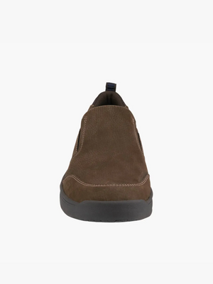 Front view of the Florsheim Mac Mocc Slip On in brown, featuring a textured surface, visible stitching, and a black rubber sole with KORE Technology, all set against a plain white background.