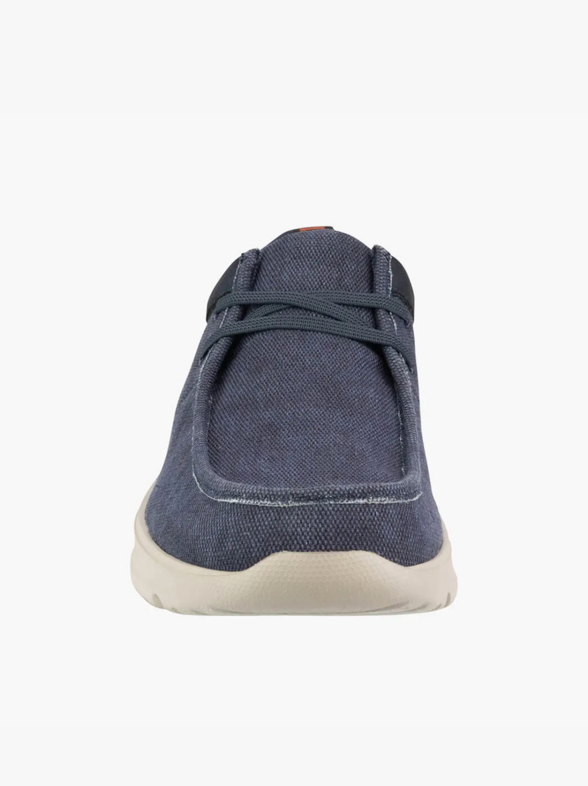 Front view of the Florsheim Bushwacker Canvas Slip On, a casual blue shoe with dark laces and a light beige sole, made from organic cotton, displayed against a plain white background.