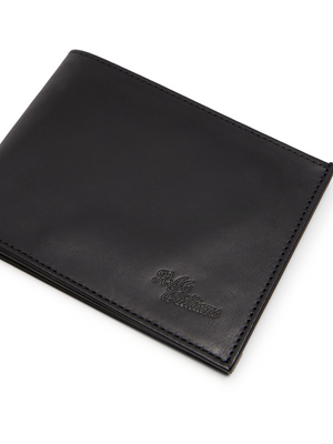 The RM Williams Singleton Bi-fold Wallet is a sleek, closed design in black calf leather with subtle edge stitching. It boasts an embossed logo on the bottom right, smooth and polished texture, and RFID protection for enhanced security.