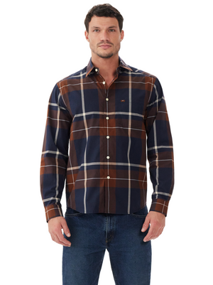A man faces forward wearing the RM Williams Coalcliff Shirt in brown, navy, and white plaid with longhorn embroidery, paired with blue jeans, set against a plain white background.