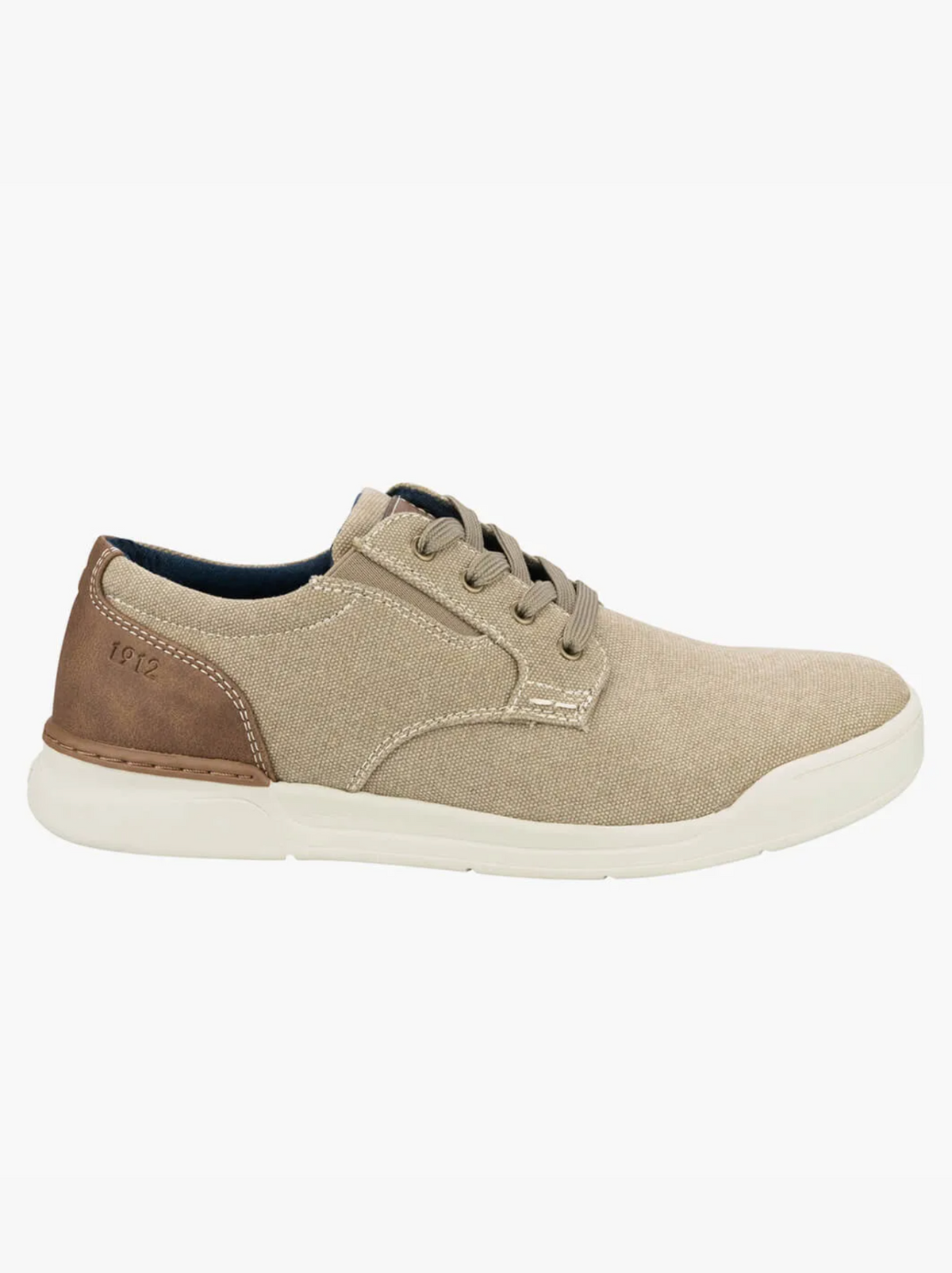The Florsheim Kore Tour Canvas Lace Sneaker provides all-day comfort with a lightweight beige canvas design, brown accents, and a white sole. It features precise brown stitching, five eyelets for laces, and a unique heel patch with "1972" elegantly inscribed.
