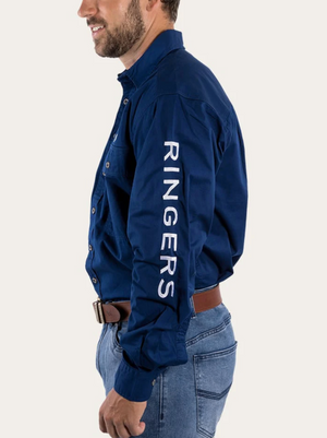 A man in profile wears a Ringers Western Hawkeye Embroidered Shirt with UPF50+ protection and "RINGERS" in white on the right sleeve, paired with light blue jeans and a brown belt, standing against a plain background.