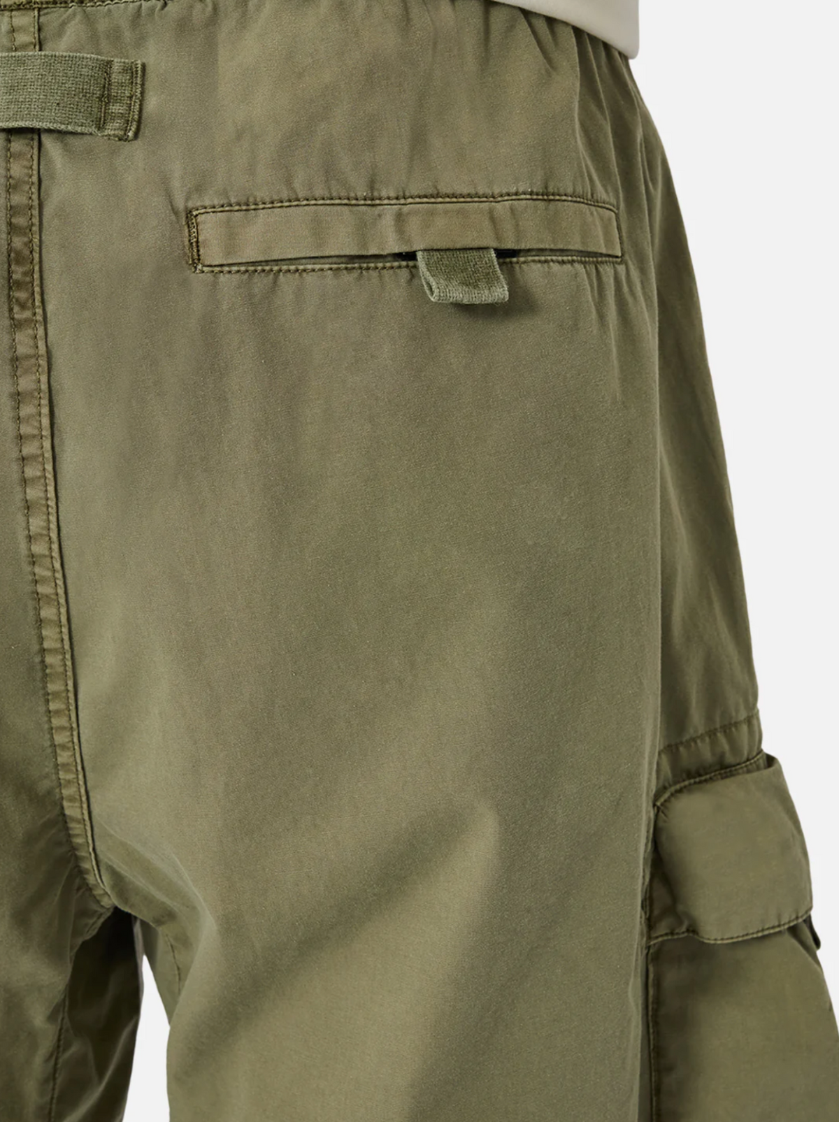 Close-up of Industrie The Del Sur Combat Short in olive green, showcasing the rear pocket with flap and button. Made from 100% cotton, the sturdy fabric features visible stitching along the seams and multiple utility pockets for both function and style.