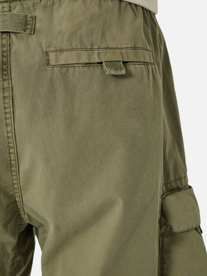 Close-up of Industrie The Del Sur Combat Short in olive green, showcasing the rear pocket with flap and button. Made from 100% cotton, the sturdy fabric features visible stitching along the seams and multiple utility pockets for both function and style.