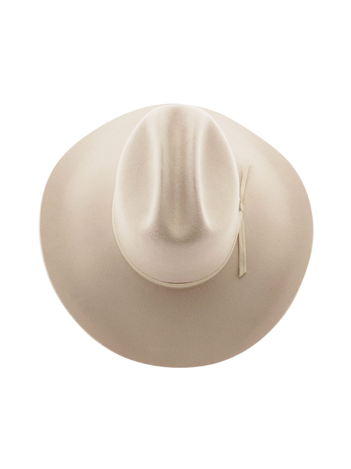 A top-view of the Statesman Serpentine Fur Felt Hat shows a beige wide-brim with a cattleman pinched crown and decorative ribbon.