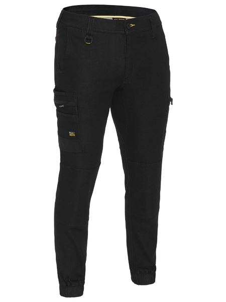 The Bisley Flex & Move Stretch Denim Cargo Cuffed Pant features Cordura durability, multiple pockets, a button and zipper closure, belt loops, and elastic ankle cuffs.