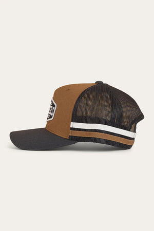 A side view of the Ringers Western Banks Trucker Cap, featuring a brown front panel, black curved brim, black mesh back, adjustable snapback, white and brown stripe detail, and a white patch on the front.