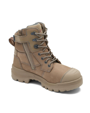 The Blundstone RotoFlex 8063 Zip Sided Safety Boot in tan features sturdy laces, a convenient side zipper, and a rugged sole. This boot is designed with reinforced areas on the toe and heel, and includes a back loop for easy pull-on. Crafted from water-resistant nubuck leather, it blends durability with comfort.