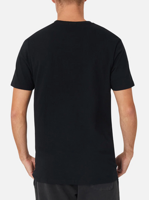 Shown from the back against a light background, a person wears dark pants and the Industrie The Basic Crew Tee in plain black, highlighting this everyday essential style.