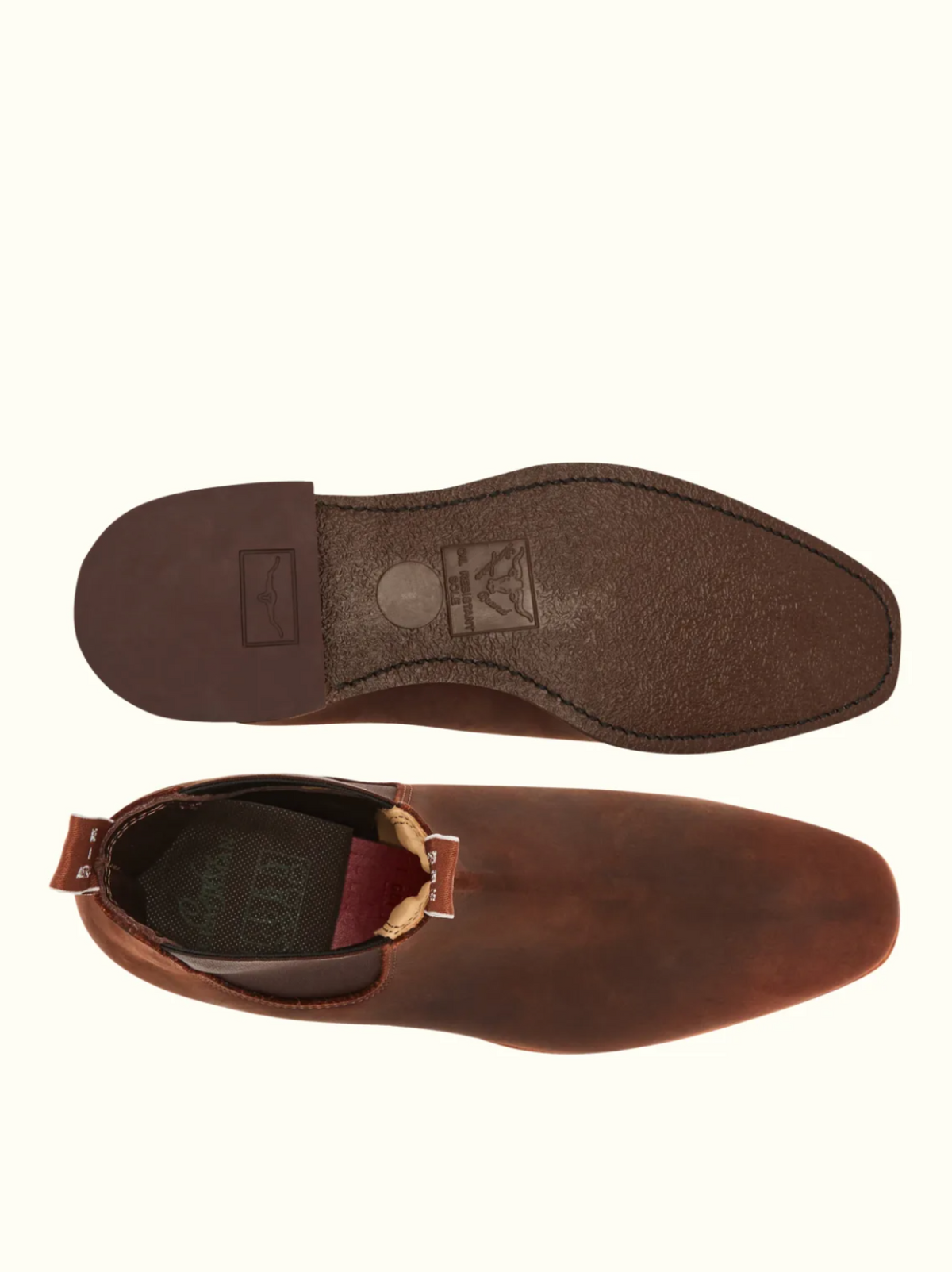 The RM Williams Comfort Craftsman Boot in brown leather, made in Australia, is shown from above and below to display its smooth upper, elastic side panel, and textured sole with branded markings.