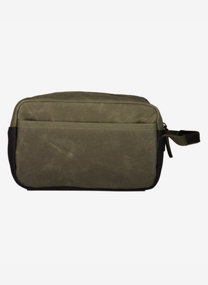 The Swanndri Island Bay Wash Bag is rectangular, crafted with durable cotton wax canvas in olive green and black. It features a zippered top, side handle, and minimalist design.