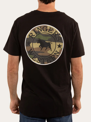 A man is wearing the Ringers Western Signature Bull Loose Fit T-Shirt, made from 100% cotton jersey. The black tee features a large "Ringers Western" logo with a bull silhouette over a camouflage pattern on the back, merging comfort with rugged style.