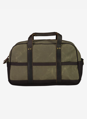 A green Swanndri Kingston Canvas Overnighter with black leather handles and trim, brass hardware, and an exterior pocket is displayed against a plain white background.