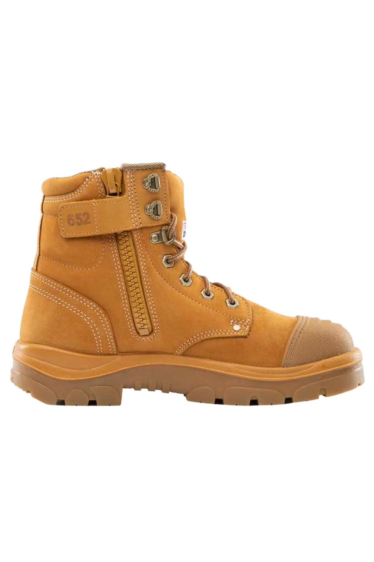 The Steel Blue Argyle Zip Scuff Cap Boot is a tan-colored work boot with a thick rubber sole, visible stitches, and metal eyelets for laces. It features a side zipper and a reinforced safety steel toe cap, with the number "652" printed near the ankle area. Made from water-resistant leather, this boot is designed for durability and heavy-duty use.