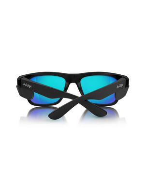 The SafeStyle Fusions Matte Black Frame Mirror Blue Polarised Lens sunglasses are shown with crossed arms on a white background, featuring a matte black frame and reflective blue polarised lenses with a faint reflection below.