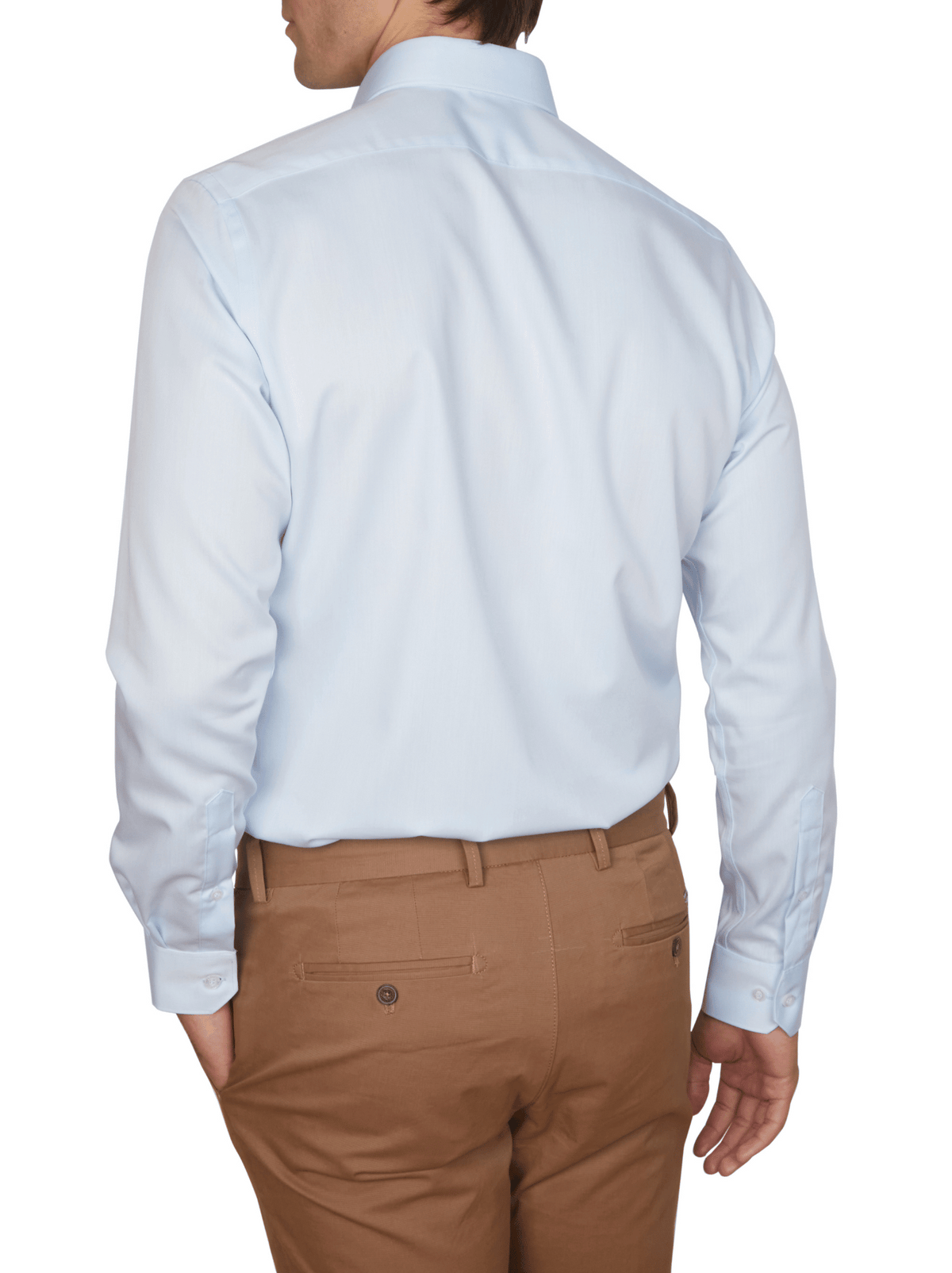 A man is shown from the back wearing an Abelard Non Iron Cotton Twill Slim Fit Shirt in light blue with a cutaway collar and tan dress pants, his left hand in his pocket.