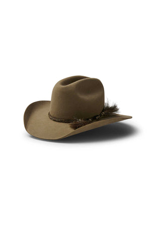The Akubra Rough Rider is a brown cowboy hat with a wide brim and a braided band accented by small feathers, shown on a white background. This durable hat combines classic style with rugged appeal.