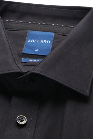 Close-up of the Abelard 4 Way Stretch Poplin Slim Fit Shirt in black, featuring a pointed collar and visible "ABELARD M" and "SLIM FIT" labels. One black button is displayed at the bottom of the image.