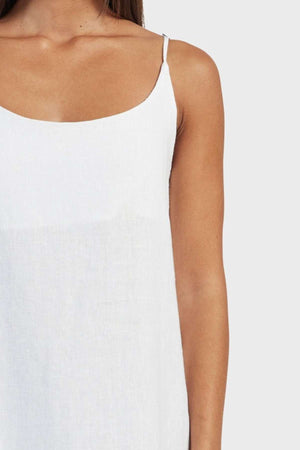 A person is wearing the Academy Women Essential Linen Slip Dress, ideal for a summer wardrobe. They are partially shown from shoulders to waist against a plain background with only the left side of their torso visible.