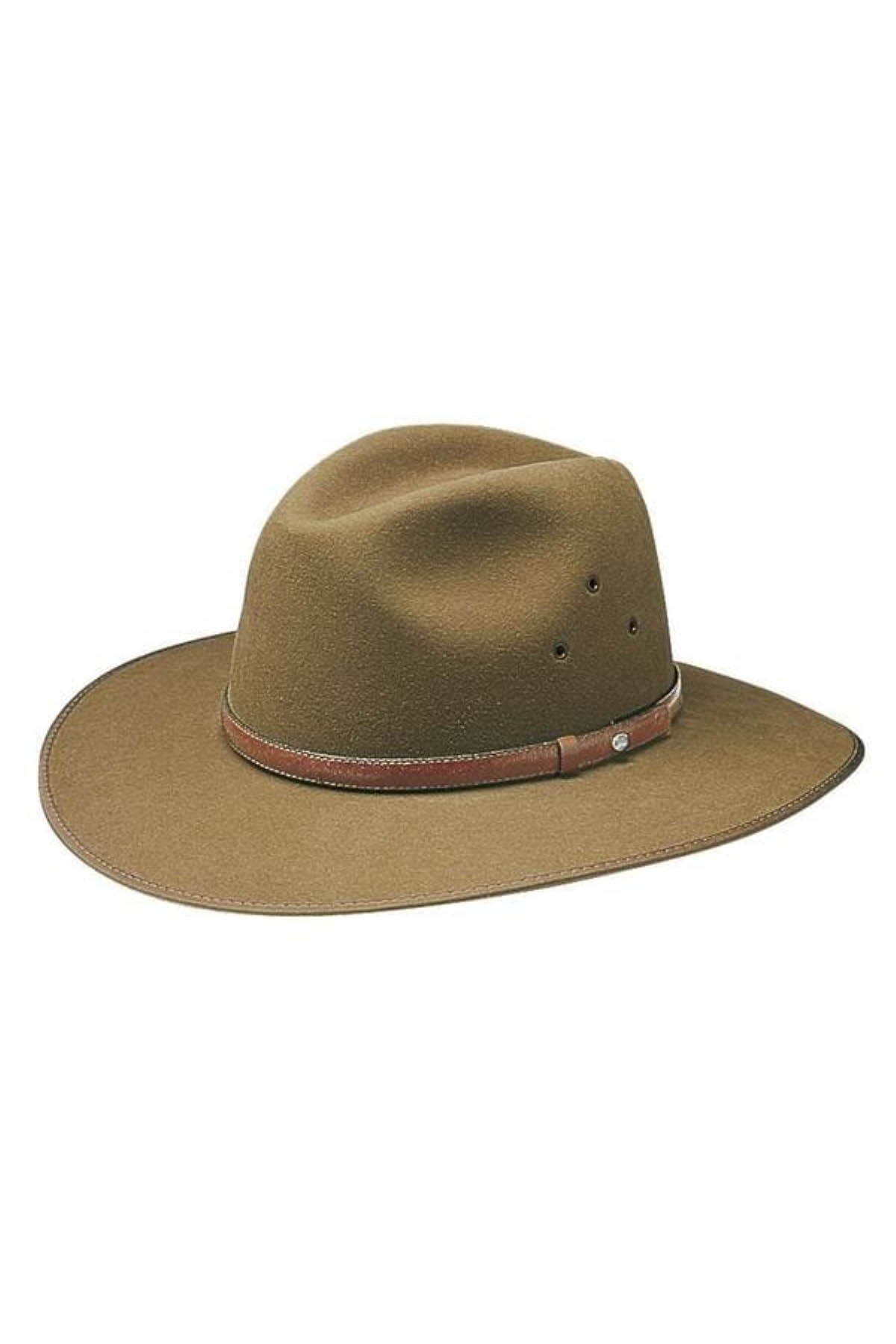 The Akubra Coober Pedy is a brown wide-brimmed hat with a pinched crown, made of felt material. It includes a brown leather band with a small silver buckle and features several ventilation eyelets on the side.