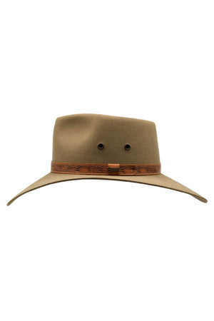 The Akubra Territory is a wide-brimmed, olive-green Fedora hat with a brown leather band featuring a detailed pattern. Reminiscent of an Akubra from the Australian Outback, the hat boasts a classic design with two ventilation holes and a structured crown.