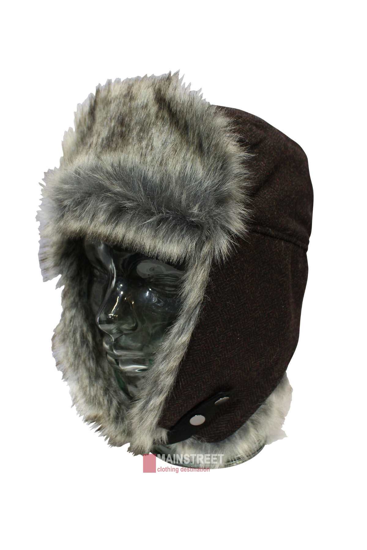 A glass mannequin head showcases an Avenel Wool Blend Herringbone Flying Cap. The winter hat in dark brown features light gray faux fur lining and trim around the edges and ear flaps, with snap buttons on the sides.