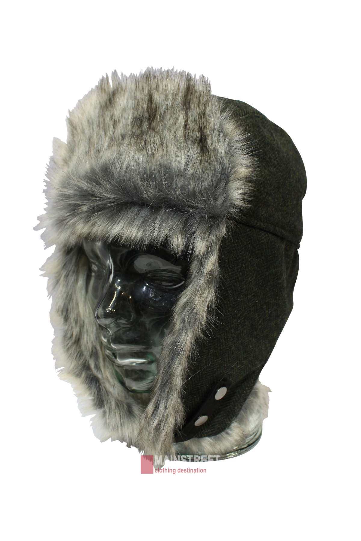 A glass mannequin head displays the Avenel Morgan Wool Blend Herringbone Flying Cap, featuring a dark winter design with faux fur trim and lining, ear flaps, and a buttoned chin strap for secure fastening.