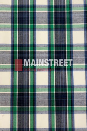 The Bisley Western Shirt features a plaid fabric with blue, green, white, and black stripes on a durable polyester/cotton blend. The "MAINSTREET clothing destination" logo appears in bold white and red lettering.
