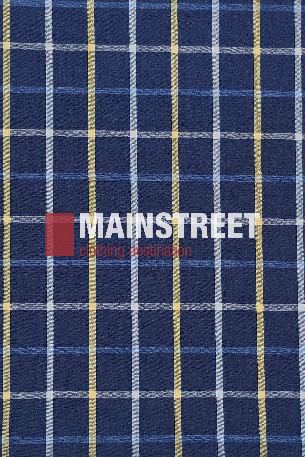 A blue plaid fabric with white and yellow lines forms the pattern of the Bisley Countryman Shirt. "MAINSTREET clothing destination" is printed across it, with "MAIN" highlighted in a red box.