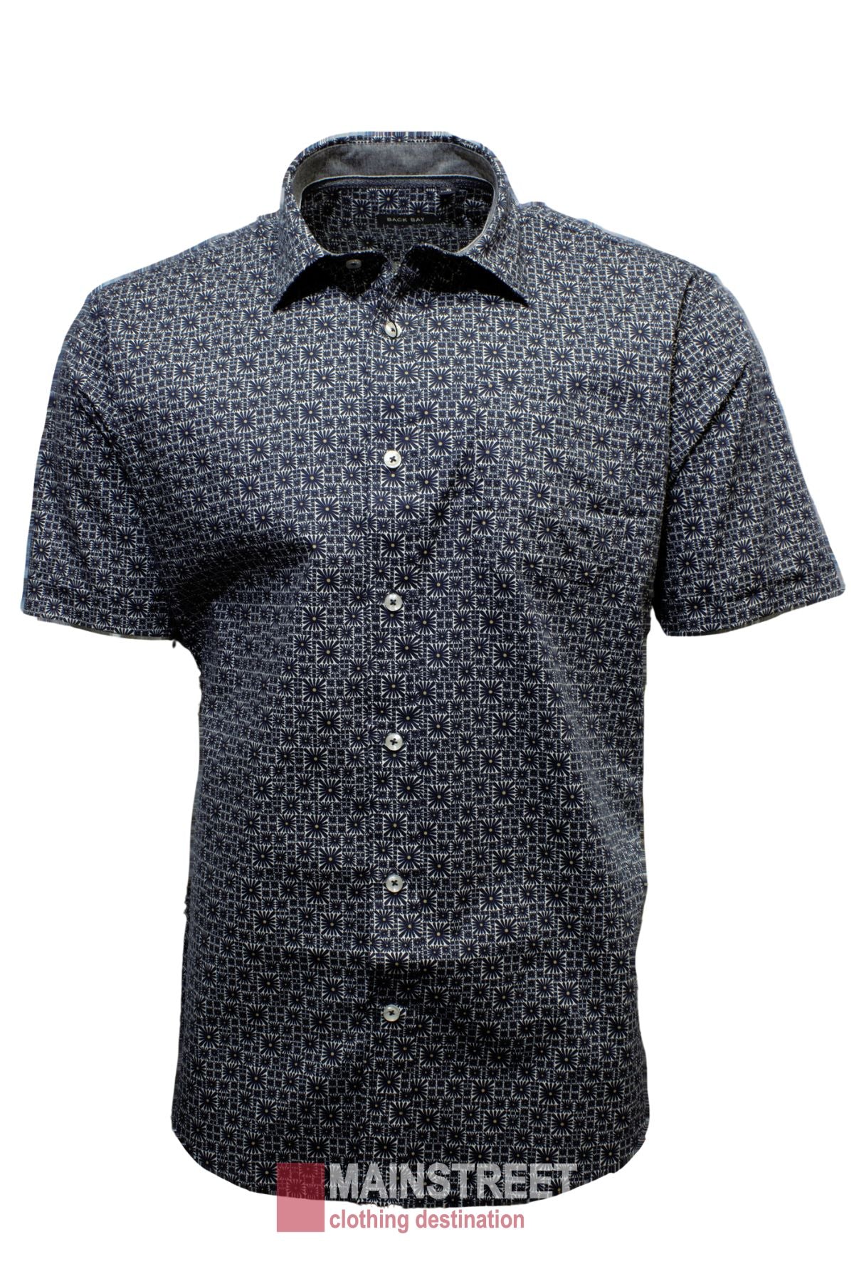The Back Bay Stretch Cotton Print Short Sleeve Shirt showcases a geometric black and white design. Made from breathable cotton, it includes a collar, dark buttons, and features the "Mainstreet clothing destination" watermark at the bottom.