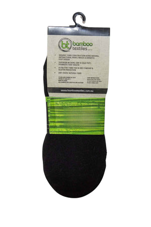 A pair of Bamboo Invisi socks in black is displayed on a hook, with packaging that incorporates a green section detailing their benefits, including moisture wicking, comfort, and anti-static properties. Made from antibacterial fabric for lasting freshness, the label also includes the website URL at the bottom.