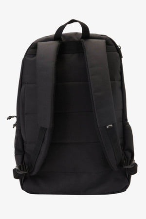 The Billabong Command Backpack in black is shown from the back, featuring padded shoulder straps, a top handle, a side pocket, and a padded laptop compartment. The design is simple and functional with minimal branding.