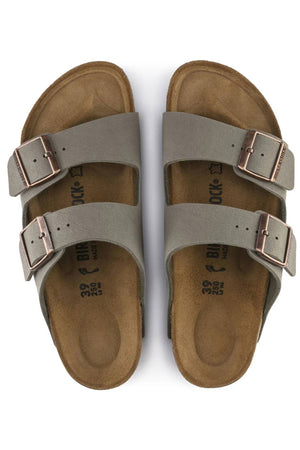 The Birkenstock Arizona sandals in gray feature two adjustable buckles per strap, a signature contoured footbed for all-day comfort, and are presented from above on a white background.