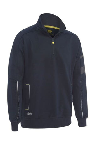 The Bisley 1/4 Zip Sherpa Lined Fleece is a navy blue long-sleeve pullover featuring a quarter-zip, standing collar, yellow accents, reflective sleeve strip, soft sherpa lining, and Bisley branding near the hem.