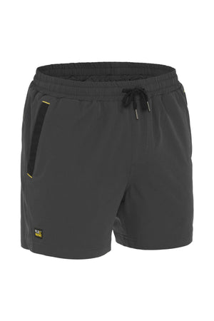Introducing the Bisley Flex & Move 4 Way Stretch Elastic Waist Short: These black athletic shorts are expertly crafted from durable Cordura fabric, offering a 4-way stretch for exceptional mobility. Designed with an elastic waistband, drawstring, and side pockets, they feature a subtle yellow text logo near the hem for added style.