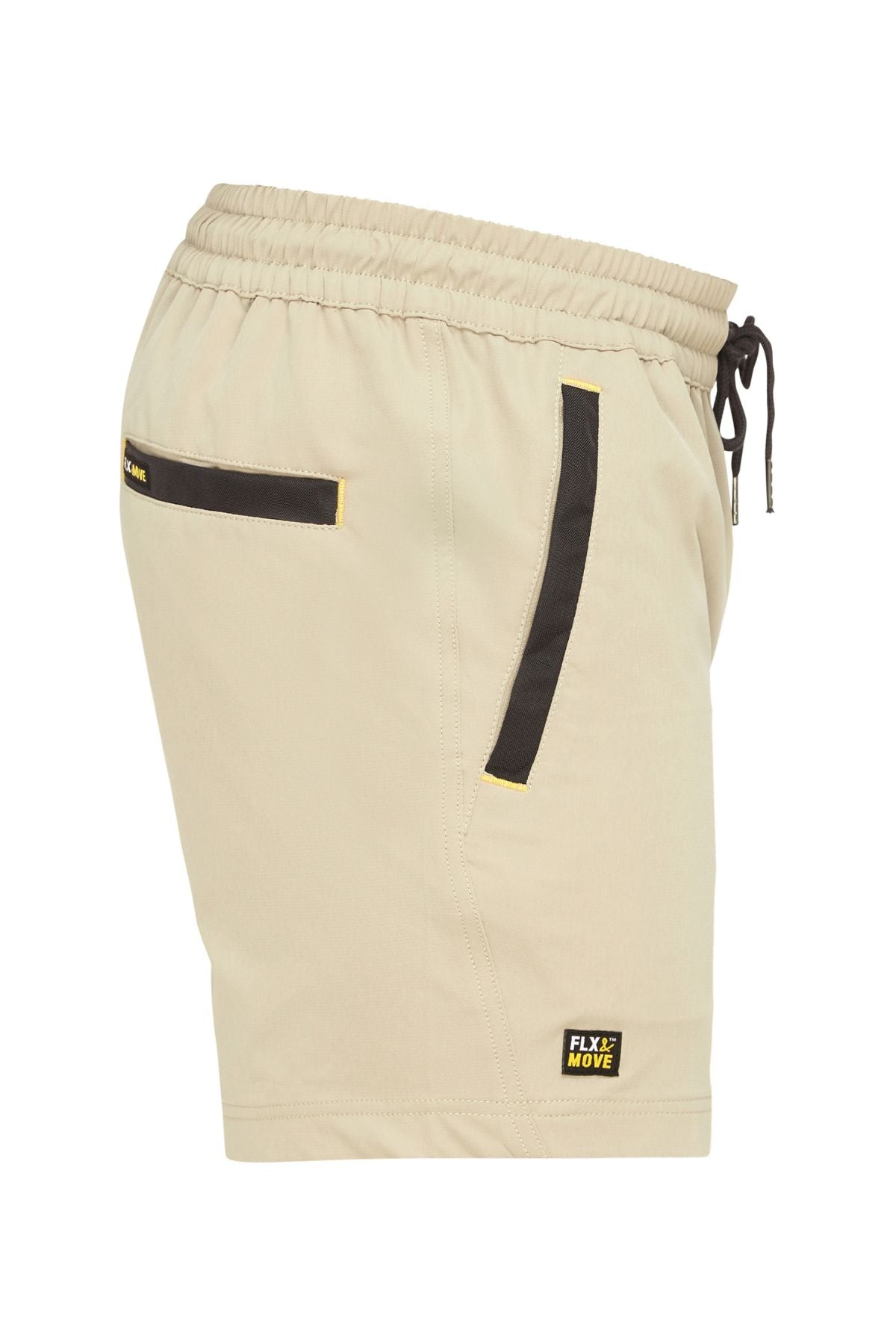 Side view of the Bisley Flex & Move 4 Way Stretch Elastic Waist Short in beige, showcasing black accented pockets and an elastic waistband with a drawstring. Made with Cordura® fabric for durability, these shorts feature a small "Flx Move" logo patch near the bottom hem.
