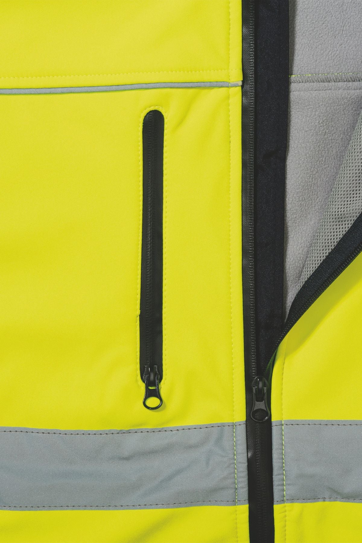 Close-up of the Bisley Hi Vis Soft Shell Taped Jacket in high-visibility yellow, showcasing its reflective taping and black zipper. The water-resistant jacket is partially unzipped, revealing a comfortable gray inner lining.