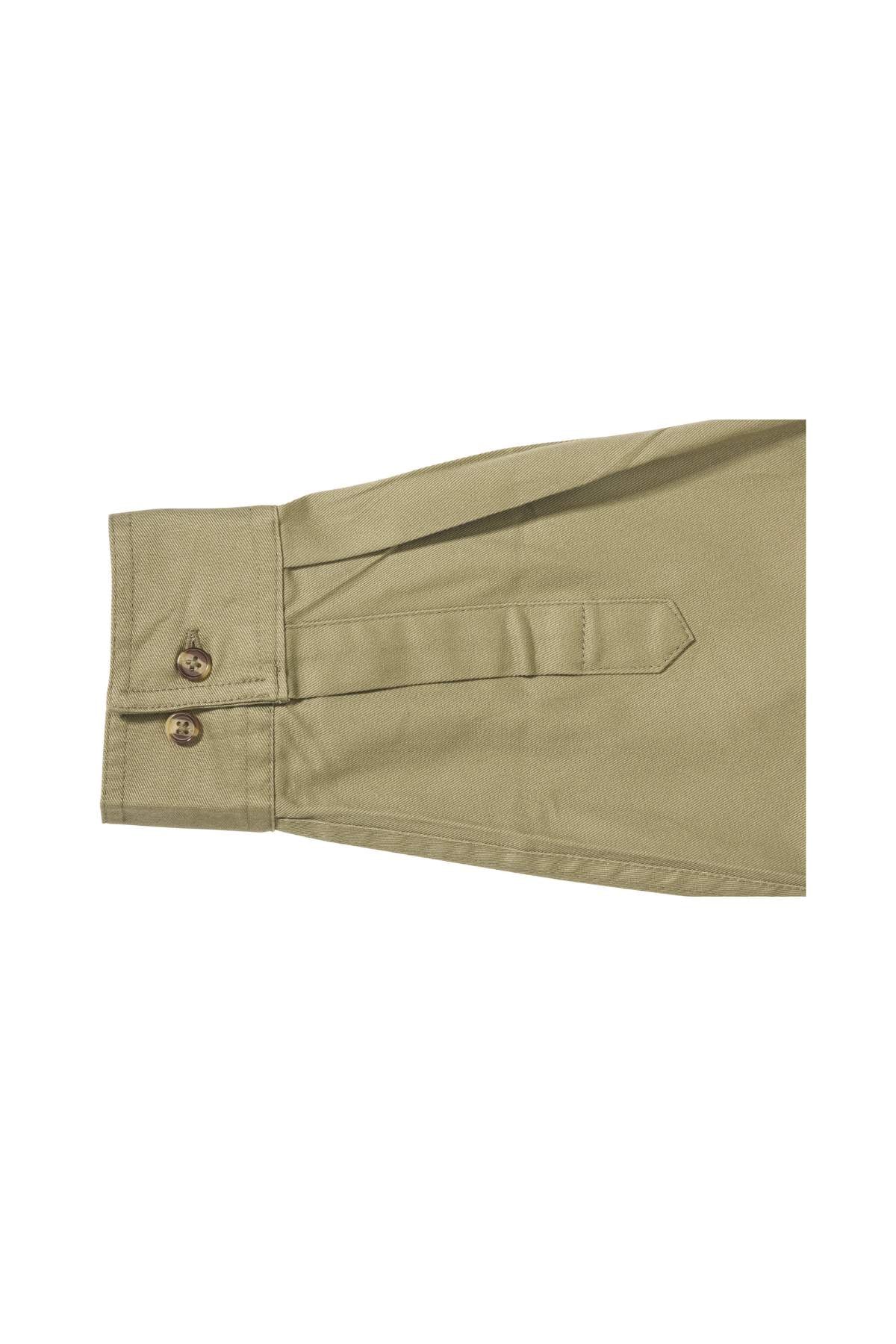 A close-up of an extended sleeve from the Bisley Original Cotton Drill Shirt in khaki shows a pointed cuff. The cuff is accented with two brown buttons and a decorative strap detail. Crafted from cotton fibre, the fabric has a smooth appearance and is neatly stitched, providing both style and sun protection.