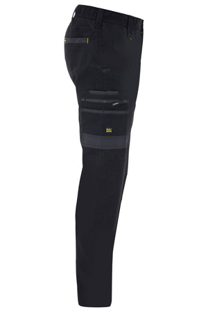 Side view of Bisley Flex & Move Stretch Canvas Elastic Waist Cargo Pant in black with multiple zippered and flap pockets, yellow stitching, Cordura® reinforcements, and an elastic waistband.