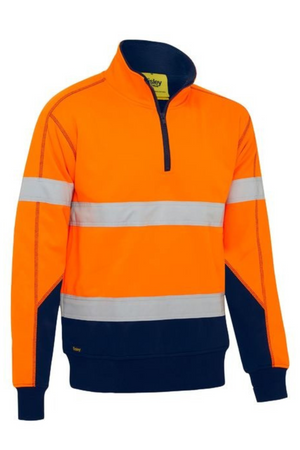 The Bisley Taped Hi Vis Fleece Pullover With Sherpa Lining is a long-sleeve, high-visibility orange and navy sweatshirt made from polyester fleece, with a half-zip front and two horizontal reflective tape stripes on the chest and arms.
