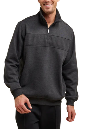 A man smiles, standing against a white background, wearing the Breakaway Zed Snowy Mt Fleece Half Zip—a dark gray pullover sweater featuring ribbed cuffs and hem.