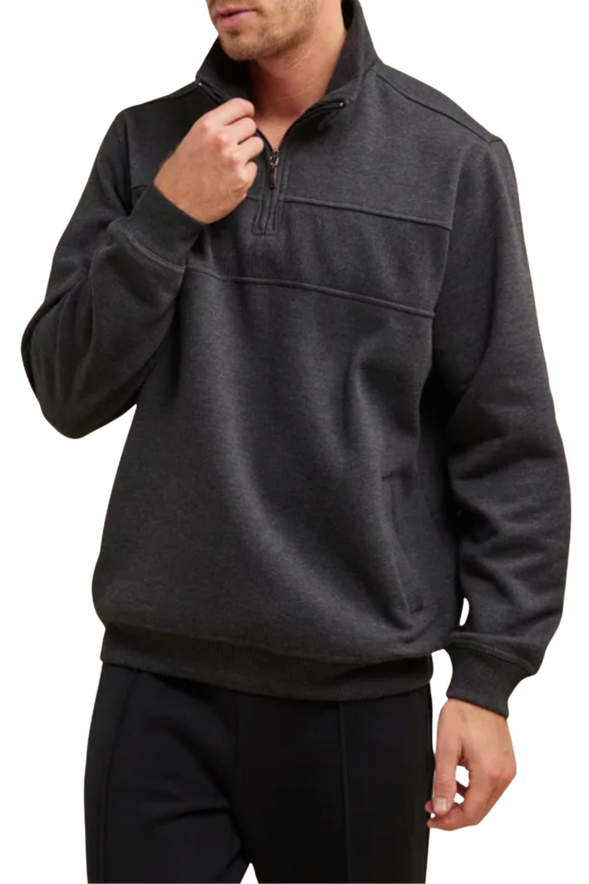 A person wears the Breakaway Zed Snowy Mt Fleece Half Zip in dark gray with black pants, standing against a plain white background. One hand is near the collar and the other rests by their side.