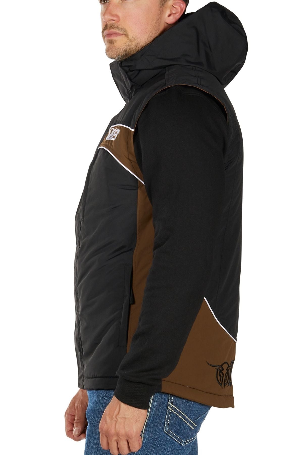 A man shown from the side wears a Bullzye Bazooka Vest with a detachable hood and brown side panels over a black long-sleeve shirt and blue jeans.