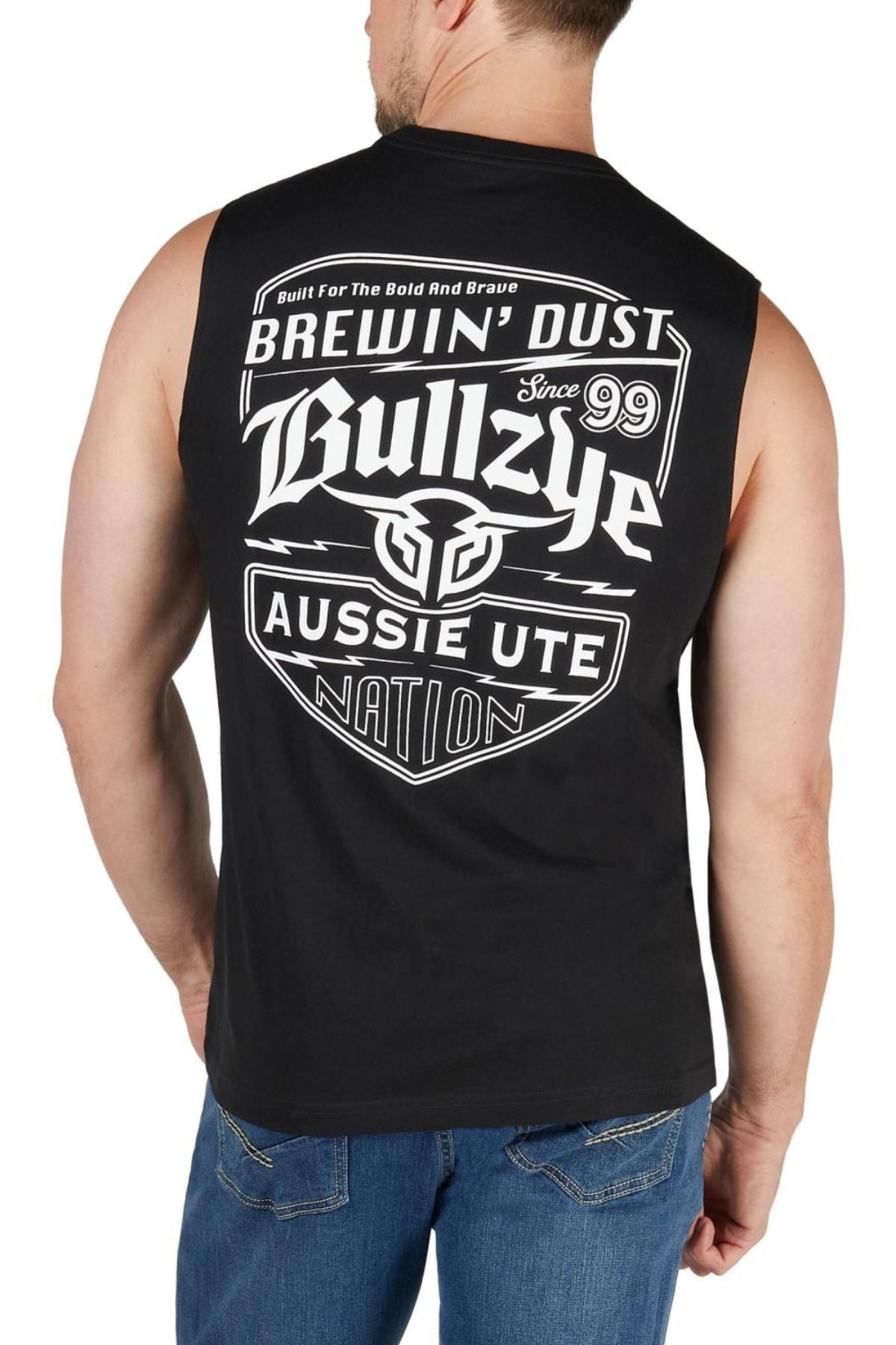 A man wears the Bullzye Brewin Dust Muscle Tank, a bold men’s casual top with striking "Brewin' Dust," “Bullzye,” and "Aussie Ute Nation" graphics on the back—perfect for those built for the bold and brave.